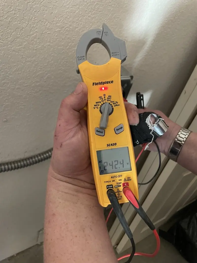 Voltage testing with clamp meter during Outlet Installation in Satsuma